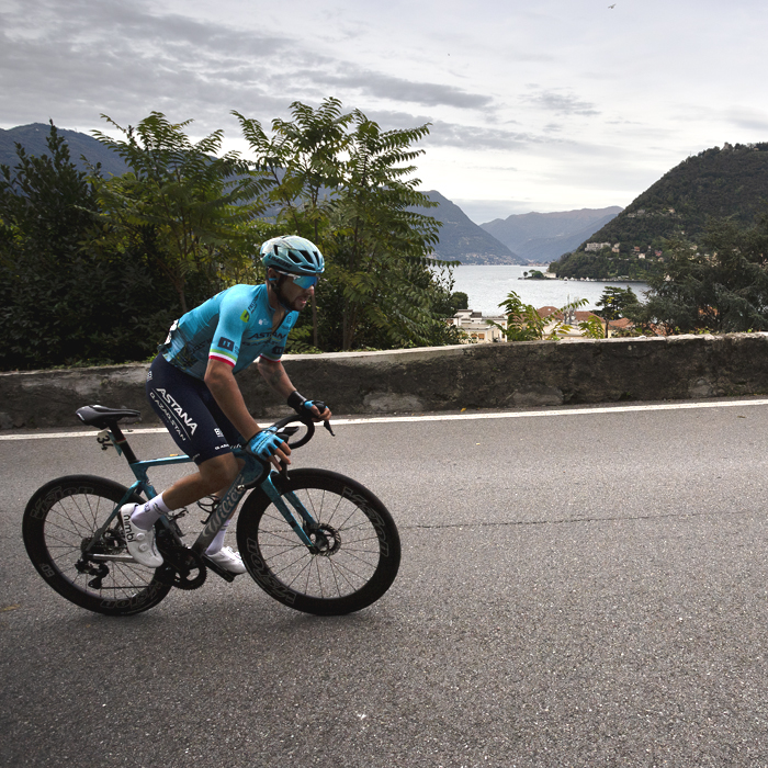 Il Lombardia 2024 - Simone Velasco of Astana Qazaqstan Team with beautiful Lake Como in the background
