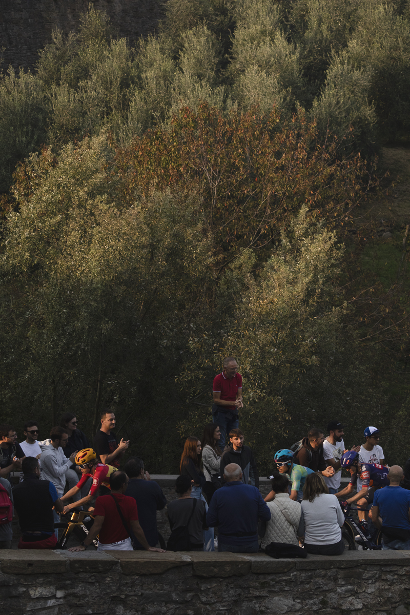 Il Lombardia 2025 - Fans stand and sit on walls at the side of the road to get a vantage point as the riders pass by in Bergamo
