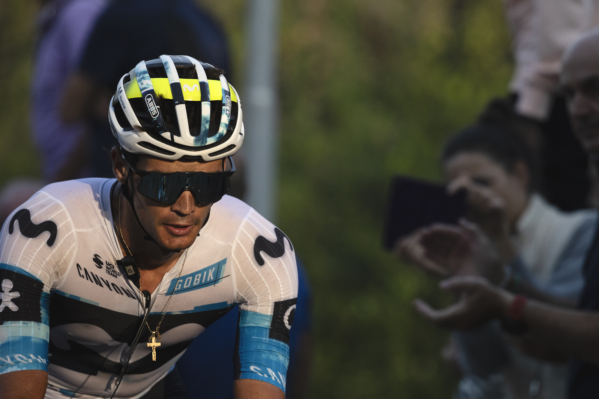 Il Lombardia 2025 - Javier Romo of Movistar Team his crucifix necklace glinting in the late afternoon sunlight as he climbs the hill
