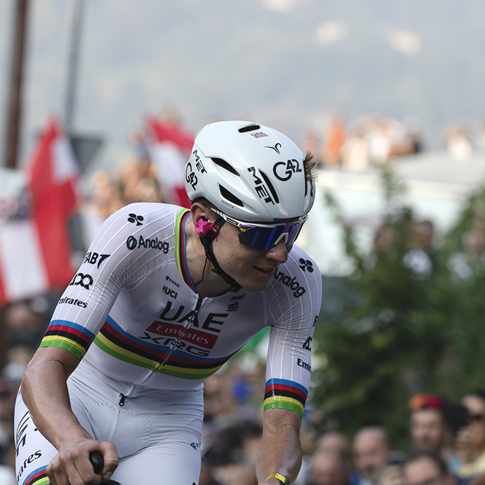 Il Lombardia 2025 - Tadej Pogačar smiles slightly as he rounds a corner on the climb