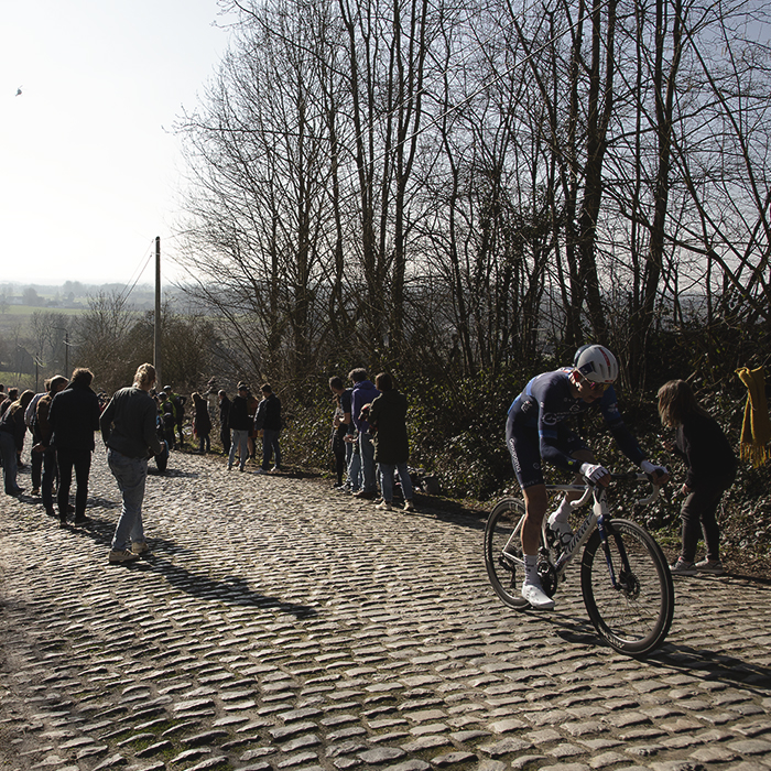 Kuurne Brussel Kuurne 2025 - Lewis Askey of Groupama - FDJ climbs on the cobbles as fans cheer him on