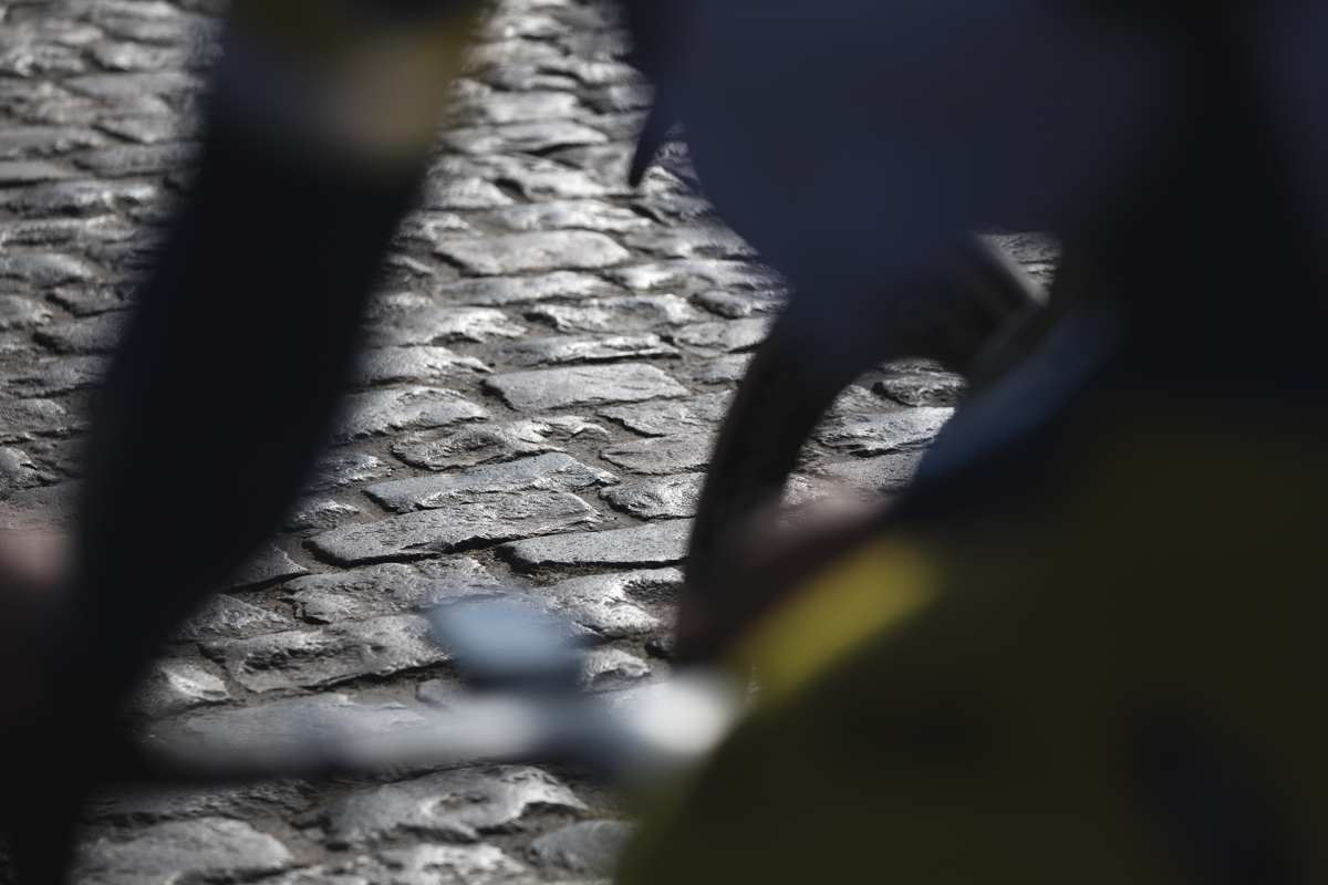Kuurne Brussel Kuurne 2025 - The cobbles of Volkemberg viewed through the close up form of a cyclist