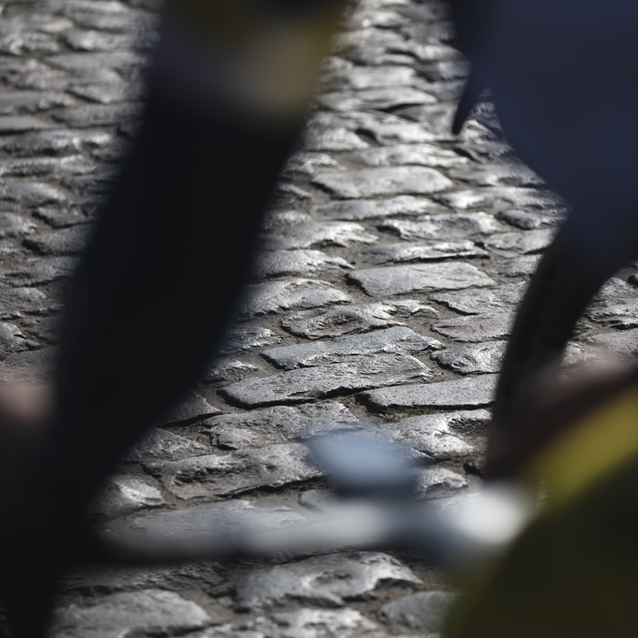 Kuurne Brussel Kuurne 2025 - The cobbles of Volkemberg viewed through the close up form of a cyclist