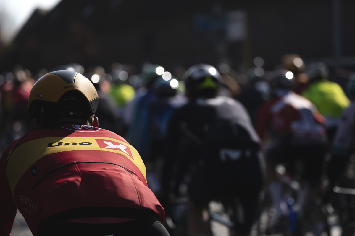 Kuurne Brussel Kuurne 2025 - A rear view of an UNO - X rider as they tackle the cobbles of Volkemberg
