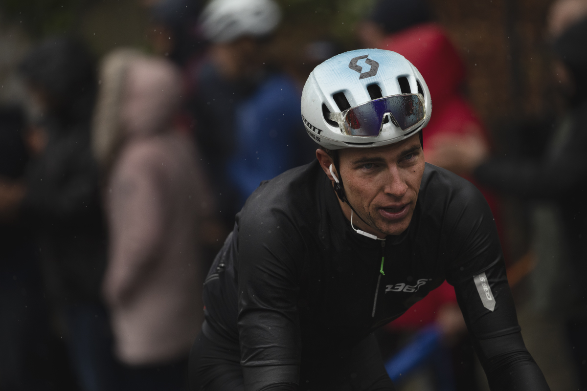 La Flèche Wallonne 2025 - Nickolas Zukowsky wearing his rain jacket as he climbs the Mur de Huy