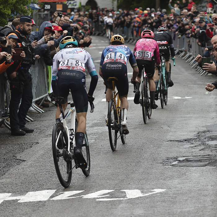 La Flèche Wallonne 2025 - Tadej Pogačar can be seen in the distance as the chasing group of riders try to catch him on the Mur de Huy