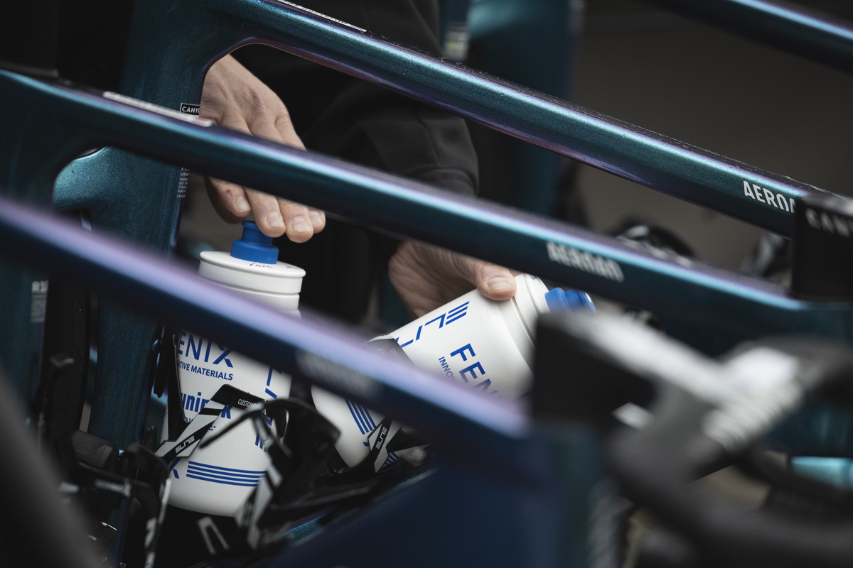 La Flèche Wallonne Femmes 2025 - Bidons are put into the cages of Fenix-Deceuninck bikes