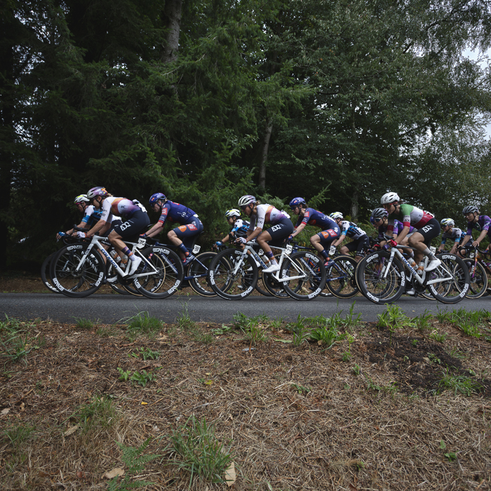 Classic Lorient Agglomération - Ceratizit 2025 - Riders take a corner on a wooded road during the race