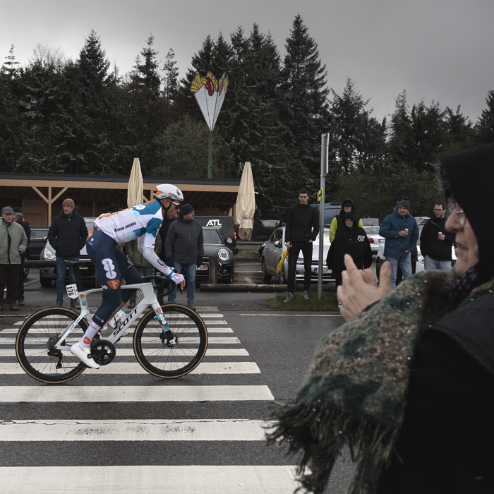 Liège-Bastogne-Liège 2024 - Martijn Tusveld is applauded by fans wrapped up in warm clothes against the elements