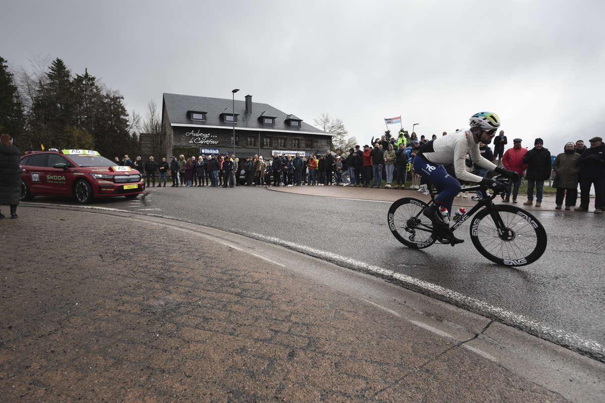 Liège-Bastogne-Liège 2024 - Paul Ourselin rounds a corner during the race at Baraque Fraiture