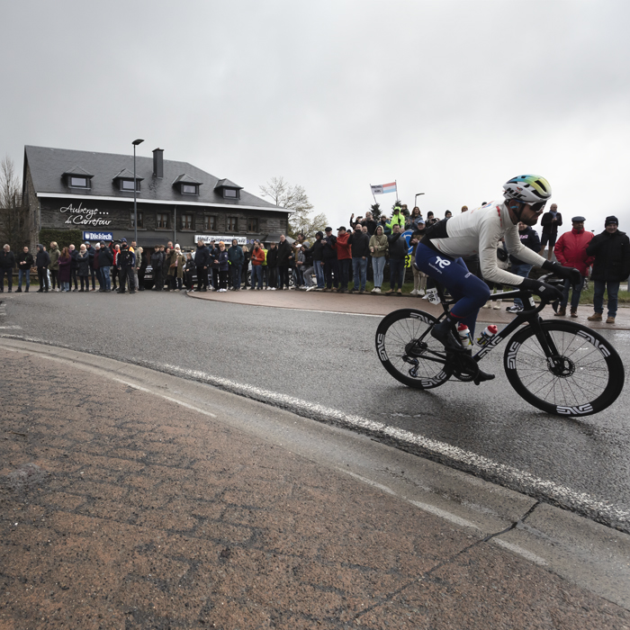 Liège-Bastogne-Liège 2024 - Paul Ourselin rounds a corner during the race at Baraque Fraiture