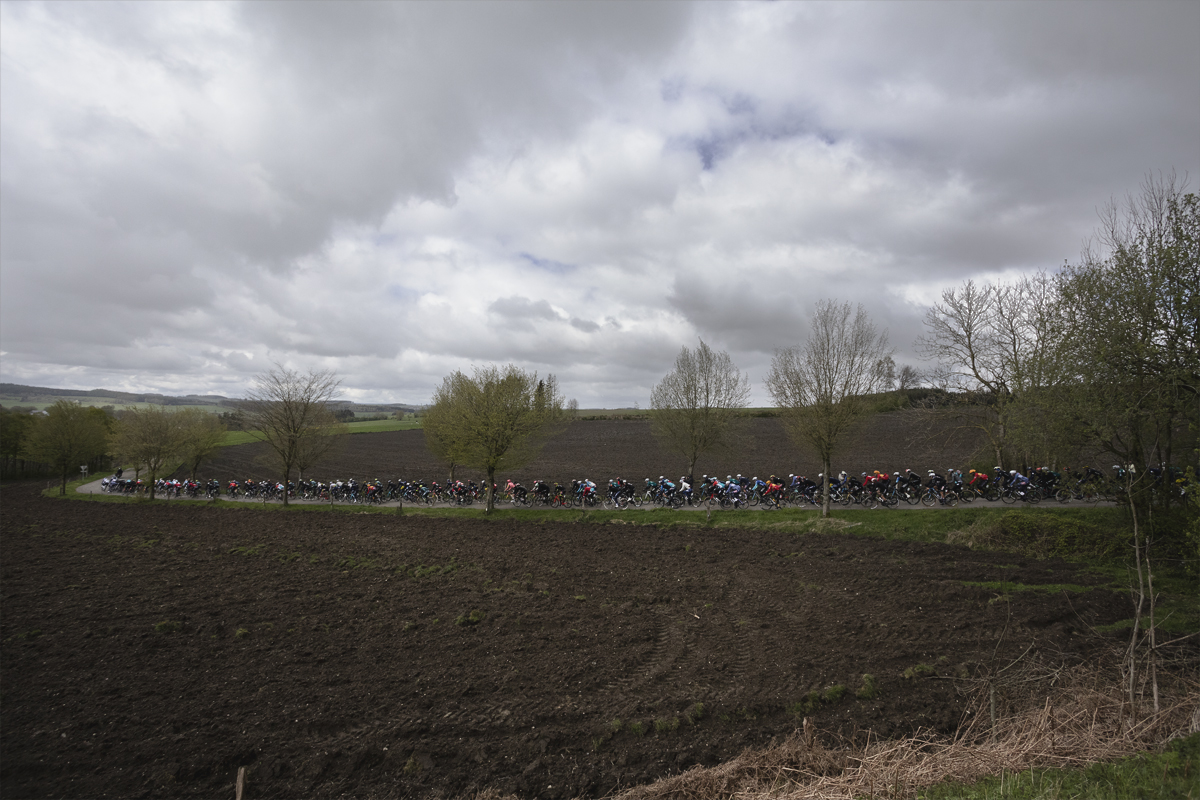 Liège-Bastogne-Liège 2024 - The race viewed across the fields at Vaux