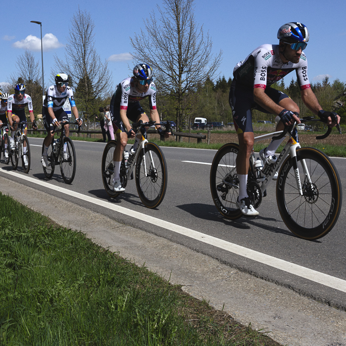 Liege Bastogne Liege 2025 - The Red Bull - BORA - hansgrohe team lead a group of riders at Baraque de Fraiture