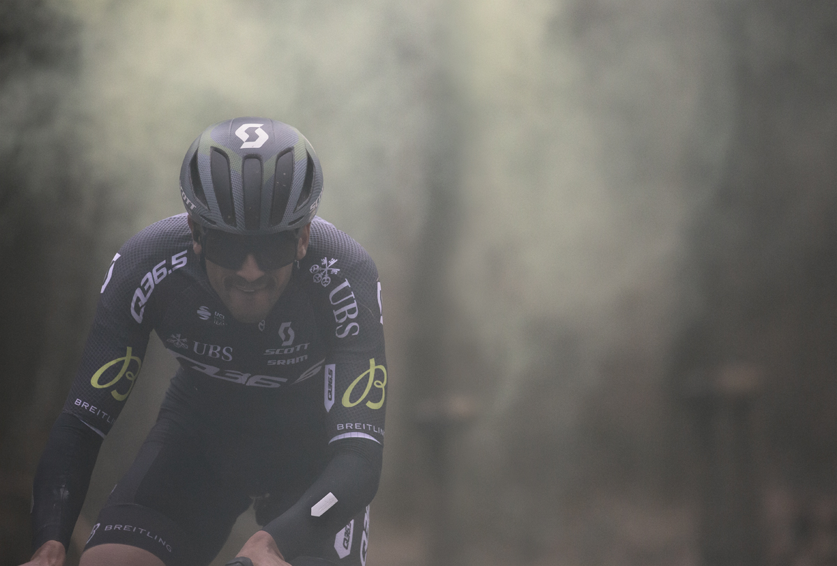 Omloop Het Nieuwsblad 2024 - Nicolò Parisini of Q36.5 Pro Cycling Team emerges from the smoke of a flare on Bosberg