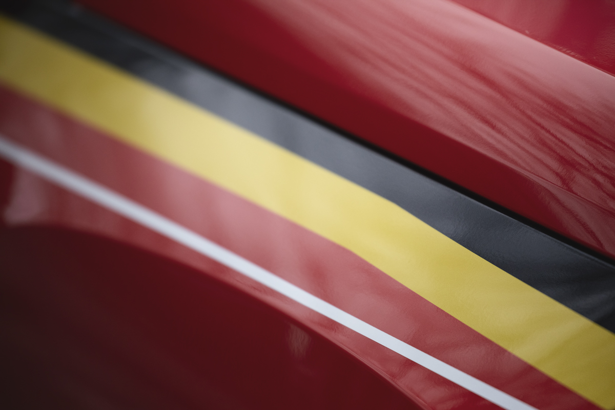 Omloop Nieuwsblad 2025 - Belgium flag stripes on an official car