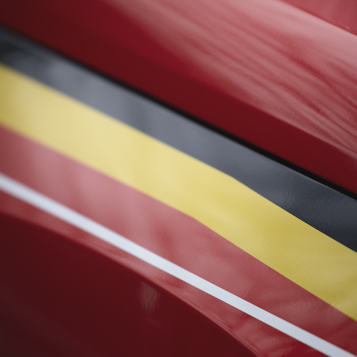 Omloop Nieuwsblad 2025 - Belgium flag stripes on an official car