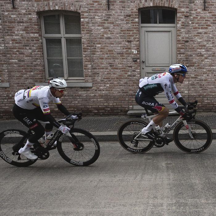 Omloop Nieuwsblad 2025 - Riders seen passing a traditional Belgian house in Kruisem