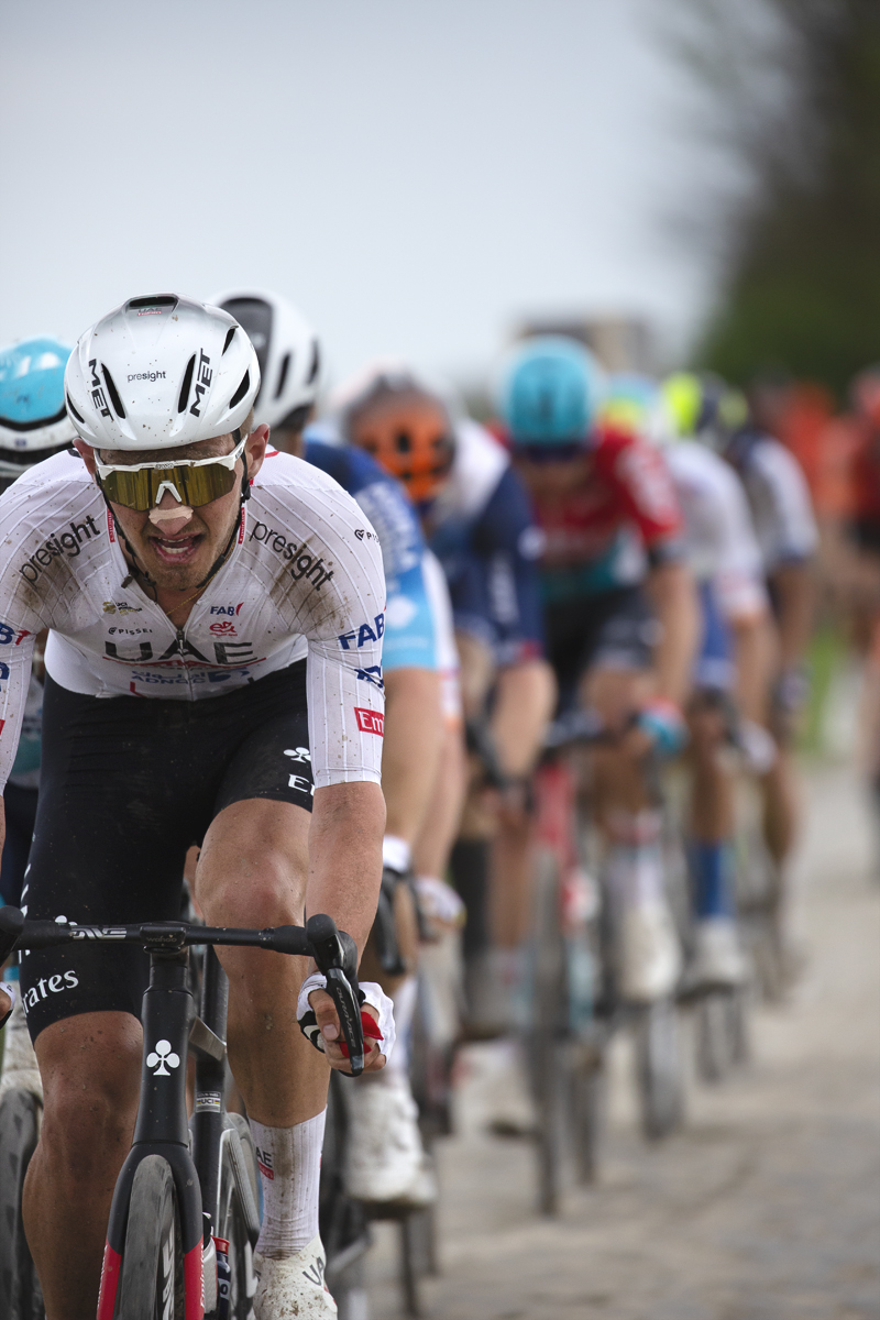 Paris Roubaix 2024 - Mikkel Bjerg of UAE Team Emirates leads a group of riders on Camphin-en-Pévèle