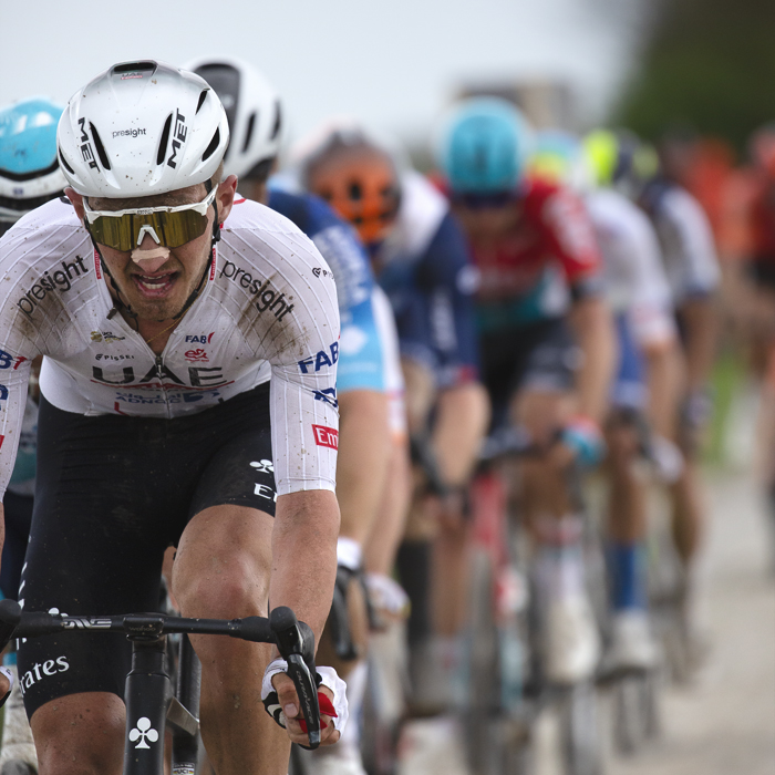 Paris Roubaix 2024 - Mikkel Bjerg of UAE Team Emirates leads a group of riders on Camphin-en-Pévèle