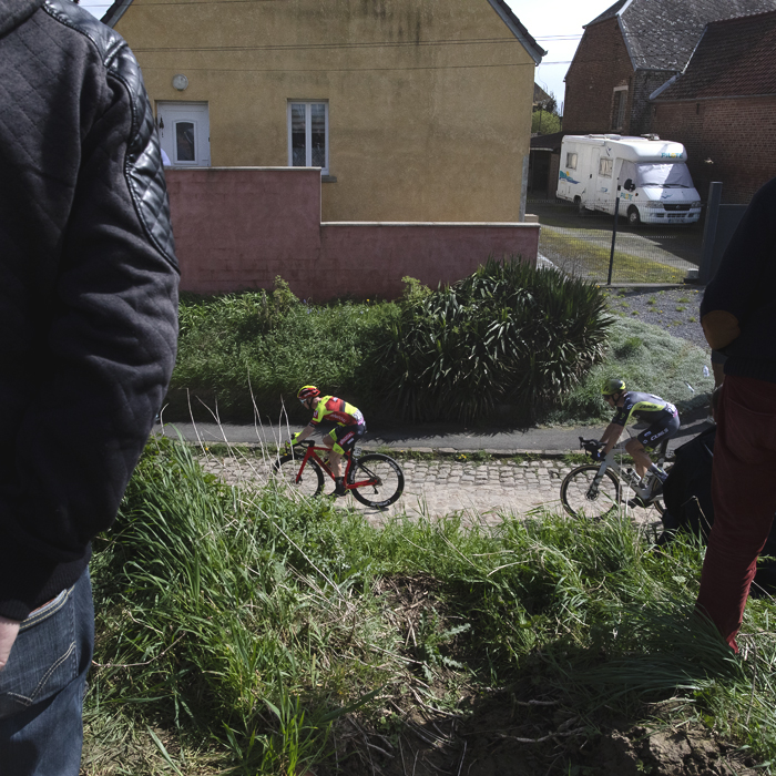 Paris Roubaix 2024 - Riders are framed by fans on the Quiévy à Saint-Python sector