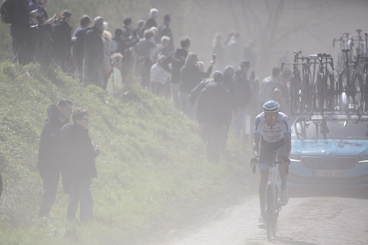 Paris Roubaix 2024 - Łukasz Wiśniowski of Bahrain - Victorious cycles through the dust on Quiévy à Saint-Python