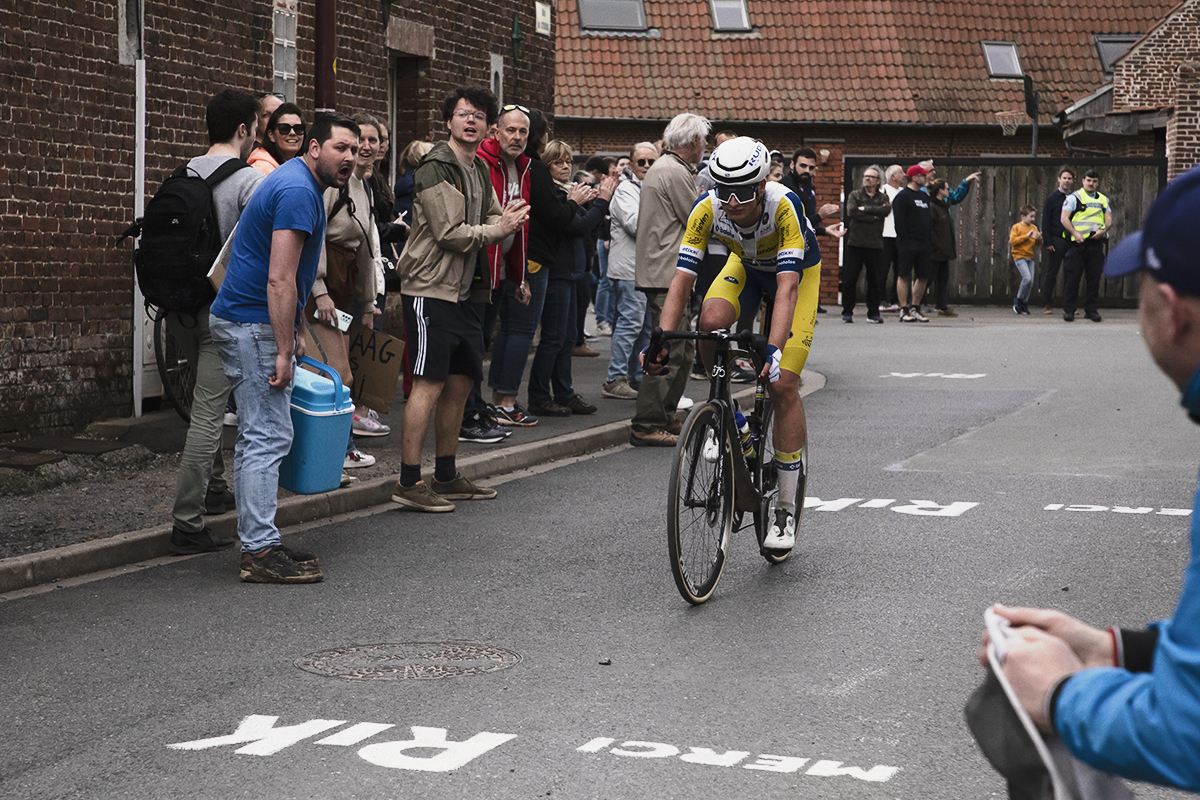 Paris Roubaix 2024 - A fan with a cool box in Camphin-en-Pévèle cheers on Victor Vercouillie