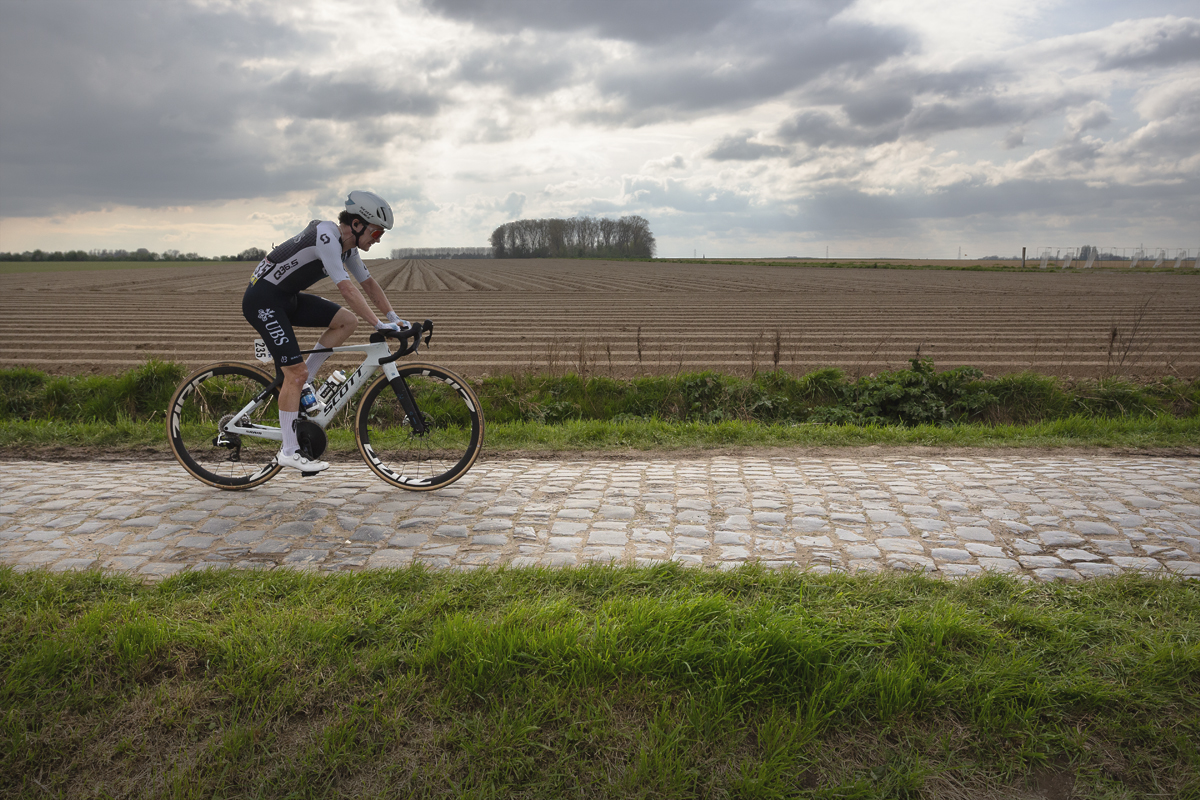 Paris Roubaix 2025 - The lone figure of Joe Pidcock against the ploughed fields of Northern France