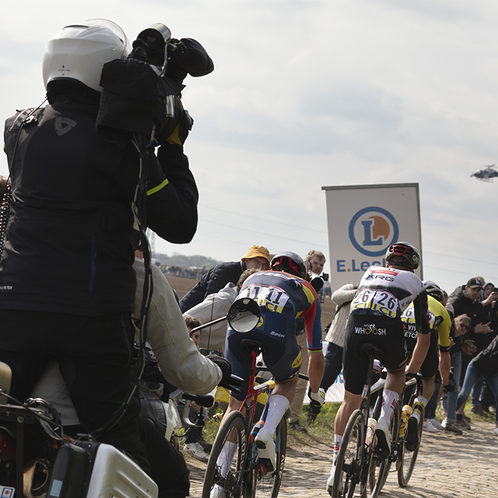 Paris Roubaix 2025 - Riders seen from behind as they tackle Carrefour De L’Arbre