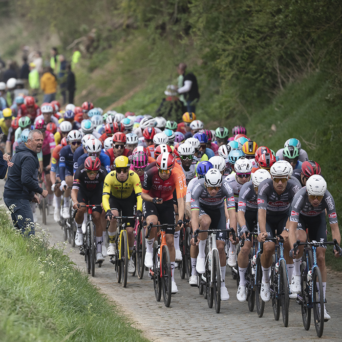 Paris Roubaix 2025 - The peloton rides down the high banked sector of Maing À Monchaux-Sur-Écaillon