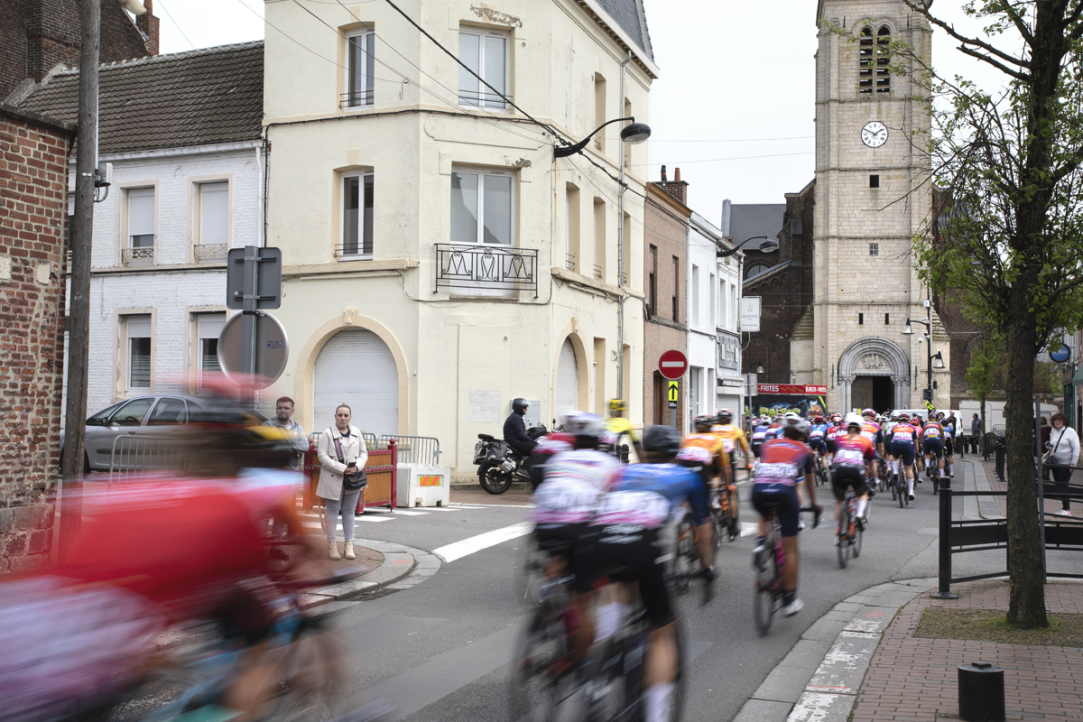 Paris Roubaix Femmes 2024 - Riders speed through the streets of Denain and past the Paroisse Saint Martin de Denain
