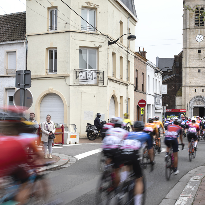 Paris Roubaix Femmes 2024 - Riders speed through the streets of Denain and past the Paroisse Saint Martin de Denain