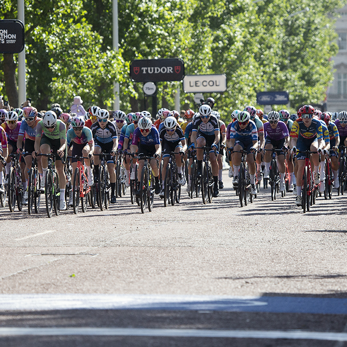 RideLondon Classique 2024 - The peloton races down The Mall in London