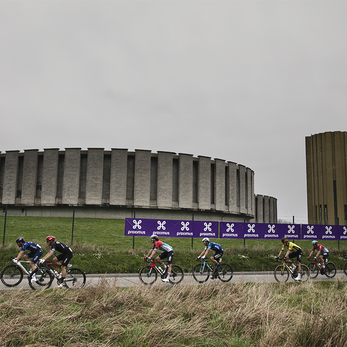 Ronde van Vlaanderen 2024 - Riders race in front of the Drinkwaterreservoir in Brakel