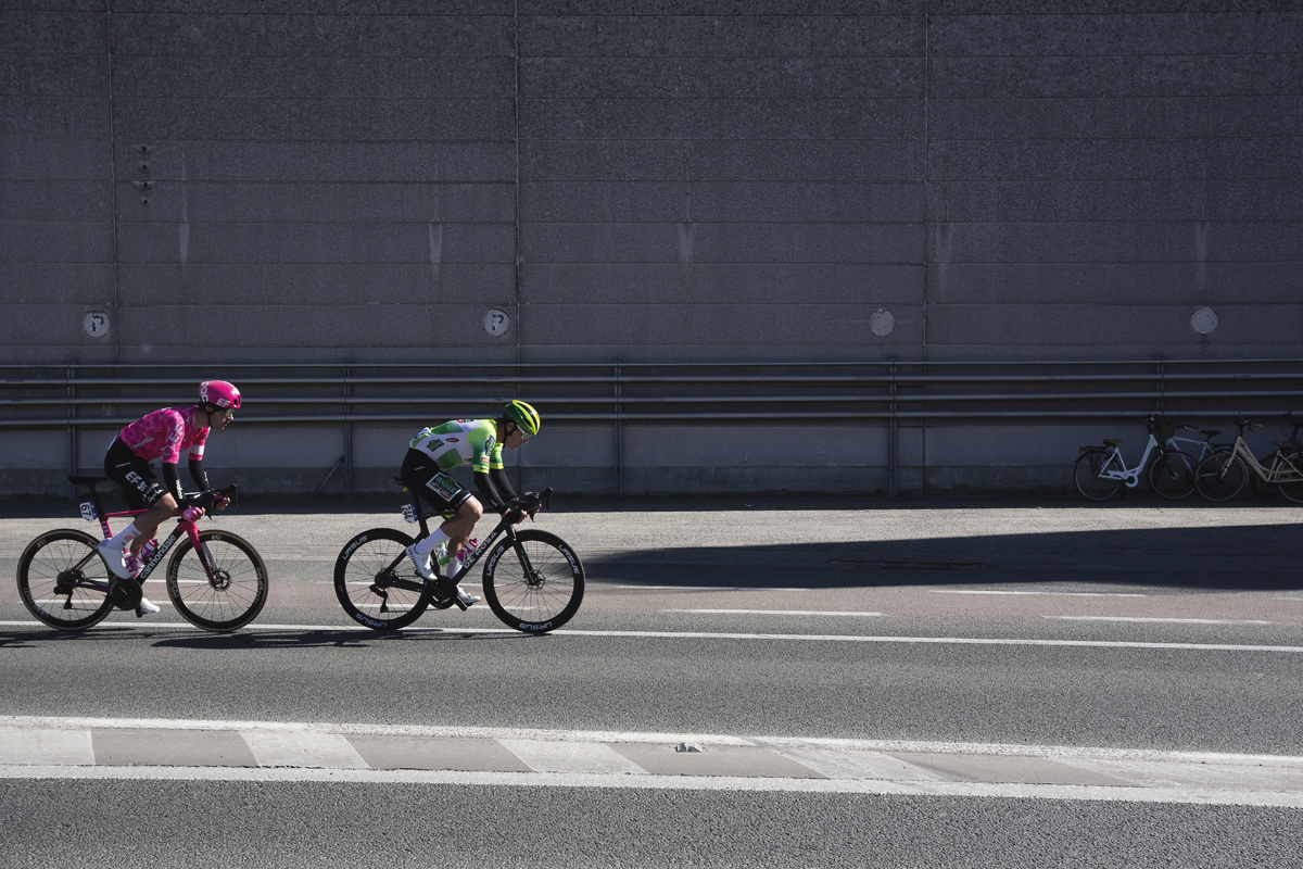 Ronde van Vlaanderen 2025 - Max Walker & Jens Reynders race past an industrial building
