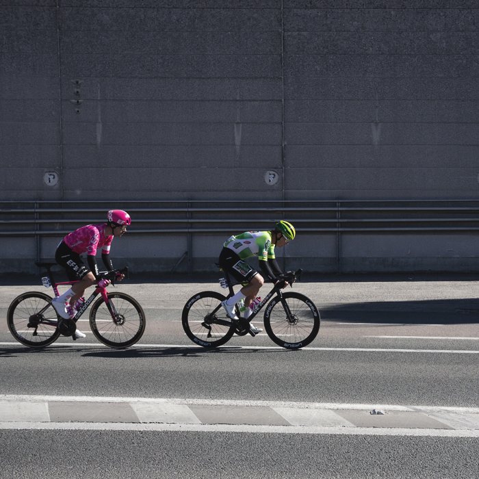 Ronde van Vlaanderen 2025 - Max Walker & Jens Reynders race past an industrial building