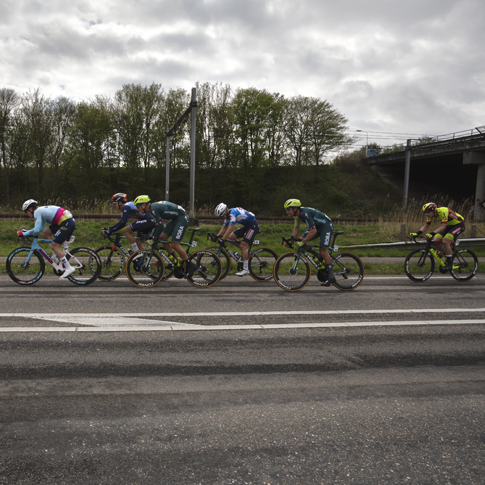 Scheldeprijs 2024 - Riders next to the train lines in Rilland