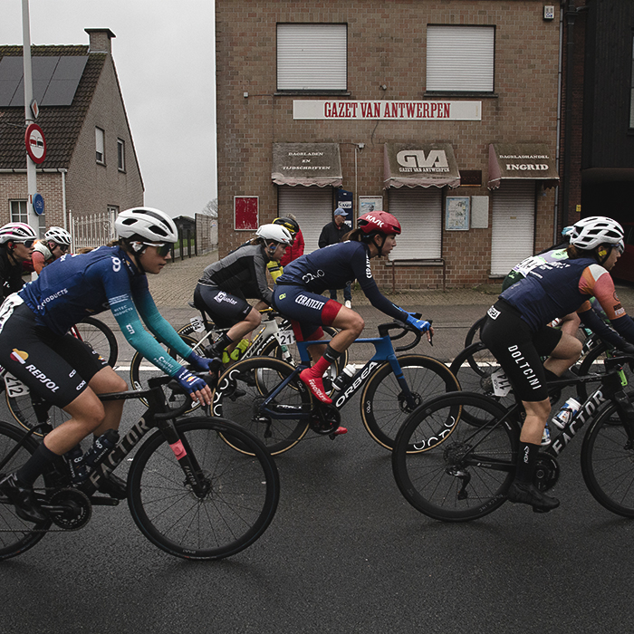 Scheldeprijs Vrouwen 2024 - The women’s peloton passes by a former newsagents shop in Achterbroek