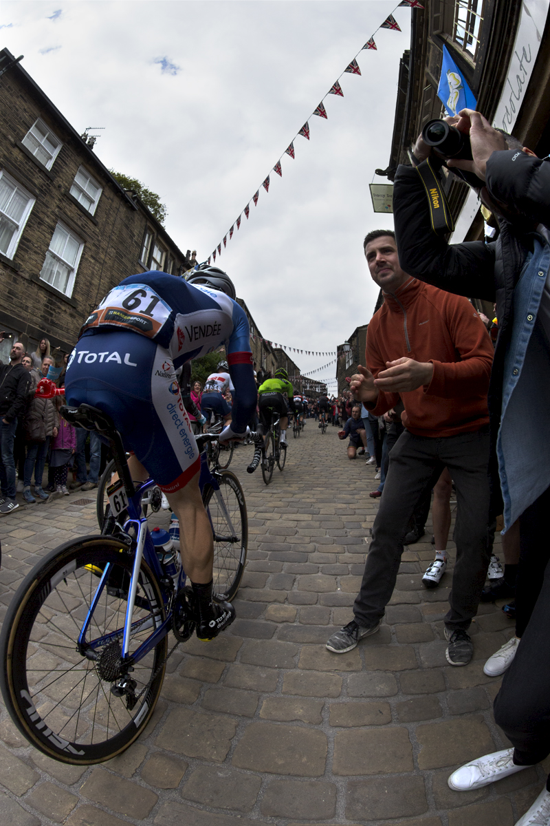 Tour de Yorkshire 2019 - Jonathan Hivert pushes past fans on the cobbled climb in Haworth
