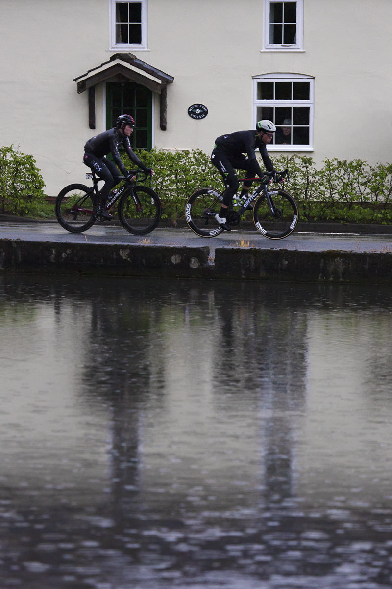 Tour de Yorkshire 2019 - An old lady looks out the window of  White Rose Cottage,  Warter to see the race pass