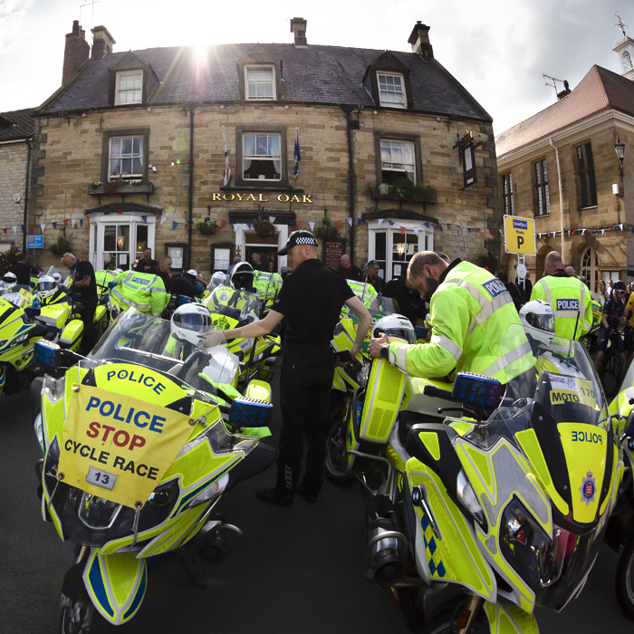 Tour of Britain 2022 - Police convoy bikes outside the Royal Oak Helmsley