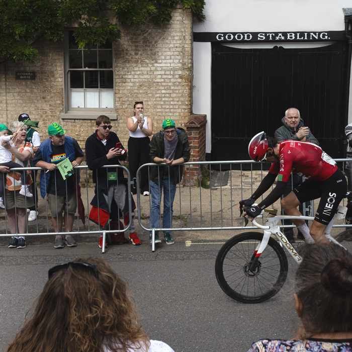 Tour of Britain 2025 - Geraint Thomas with his head down rides past cheering fans