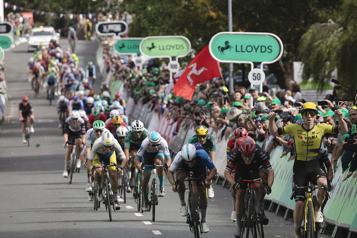 Tour of Britain 2025 - Matthew Brennan raises his hands as he sprints to victory in the stage