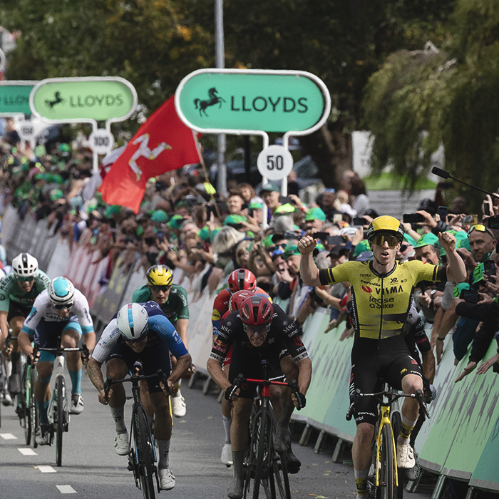 Tour of Britain 2025 - Matthew Brennan raises his hands as he sprints to victory in the stage