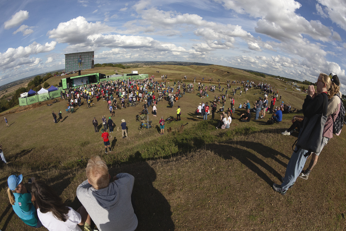 Tour of Britain 2025 - Fans take up a vantage point on a hill at Burton Dassett to watch the podium presentations