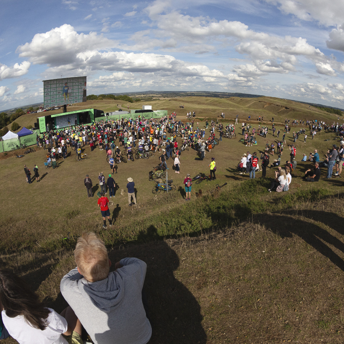 Tour of Britain 2025 - Fans take up a vantage point on a hill at Burton Dassett to watch the podium presentations