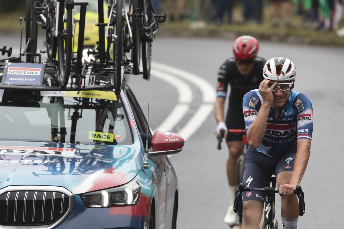 Tour of Britain 2025 - Ethan Hayter puts his hand to his face in disbelief at the scenes on Caerphilly Mountain