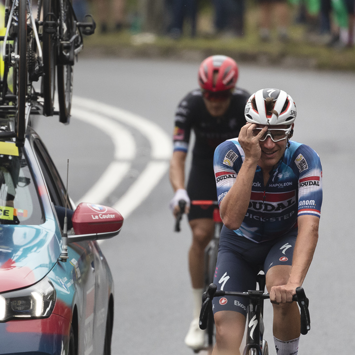 Tour of Britain 2025 - Ethan Hayter puts his hand to his face in disbelief at the scenes on Caerphilly Mountain