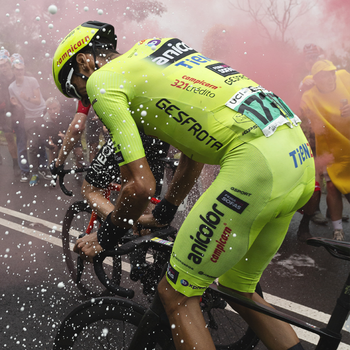 Tour of Britain 2025 - Rafael Reis is greeted by champagne and flares on his way up the mountain