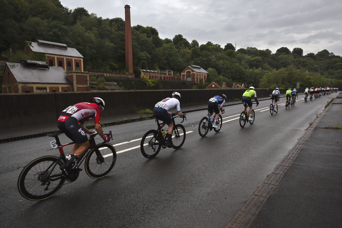 Tour of Britain 2025 - Riders pass the disused but impressive Crumlin Navigation Colliery building