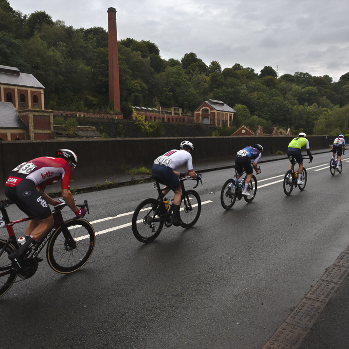 Tour of Britain 2025 - Riders pass the disused but impressive Crumlin Navigation Colliery building